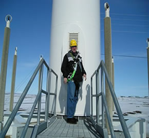 Bill Thomson of TTG on a wind tower of a wind-diesel hybrid system in western Alaska.